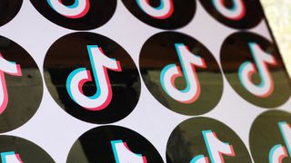 TikTok logos in a pattern on a monitor